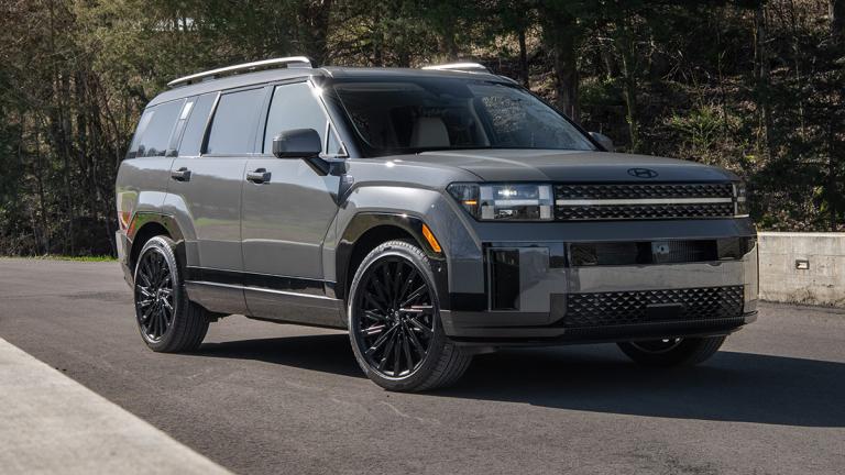 2025 Hyundai Santa Fe driving on the road.